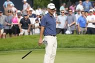 Brian Harman reacts after missing a birdie put on the 18th green during the second round of the BMW Championship